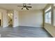 Living room with hardwood floors and a view to the stairs at 6050 Belvedere Canyon Ave, Las Vegas, NV 89139