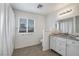 Clean bathroom featuring a shower/tub combo, vanity with granite countertop, and white cabinets at 628 L, Boulder City, NV 89005