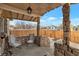 Cozy front porch with stone detailing and two chairs at 628 L, Boulder City, NV 89005