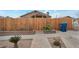 Inviting front yard with wooden fence and stone accents at 628 L, Boulder City, NV 89005