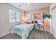 Stylish bedroom with a pink accent wall and a workspace at 6546 Coffee Theme St # Lot 11, North Las Vegas, NV 89084