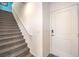 Modern staircase with grey carpet runner and white door at 6546 Coffee Theme St # Lot 11, North Las Vegas, NV 89084