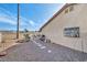 Backyard with gravel, small sandbox, and walkway at 659 Glenwood Ln, Henderson, NV 89002