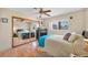 Cozy bedroom with mirrored closet doors and wood floors at 659 Glenwood Ln, Henderson, NV 89002