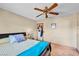 Well-lit bedroom with ceiling fan and hardwood floors at 659 Glenwood Ln, Henderson, NV 89002