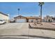 House exterior with a two-car garage and well-maintained landscaping at 659 Glenwood Ln, Henderson, NV 89002