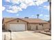 Single-story house with a large driveway and a star-shaped accent above the garage at 659 Glenwood Ln, Henderson, NV 89002