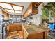 Kitchen features wood cabinets and a tile countertop at 659 Glenwood Ln, Henderson, NV 89002