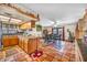 Cozy kitchen features wood cabinets, tile countertops, and an island at 659 Glenwood Ln, Henderson, NV 89002