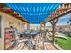 Covered patio with seating and view of backyard at 659 Glenwood Ln, Henderson, NV 89002