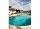 Relaxing kidney-shaped pool with a patio and surrounding landscape at 659 Glenwood Ln, Henderson, NV 89002