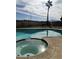 Large backyard pool and spa with a view of the surrounding landscape at 659 Glenwood Ln, Henderson, NV 89002