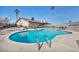 Relaxing kidney-shaped pool with ladder access at 659 Glenwood Ln, Henderson, NV 89002