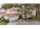 Aerial view of charming two-story home with tile roof and attached garage at 6973 Emerald Springs Ln, Las Vegas, NV 89113