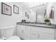 Modern bathroom with single vanity and toilet at 6973 Emerald Springs Ln, Las Vegas, NV 89113