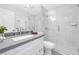 Modern bathroom with gray vanity, white cabinets, and shower at 6973 Emerald Springs Ln, Las Vegas, NV 89113