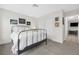 Guest bedroom with a metal bed frame and closet at 6973 Emerald Springs Ln, Las Vegas, NV 89113