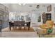 Open dining room with hardwood floors and view of the kitchen at 6973 Emerald Springs Ln, Las Vegas, NV 89113