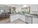 Modern kitchen with stainless steel appliances and gray countertops at 6973 Emerald Springs Ln, Las Vegas, NV 89113