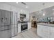 Modern kitchen with stainless steel appliances and white cabinetry at 6973 Emerald Springs Ln, Las Vegas, NV 89113