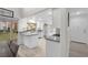 Modern kitchen with stainless steel appliances and gray countertops at 6973 Emerald Springs Ln, Las Vegas, NV 89113