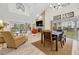 Bright living room features vaulted ceilings, a fireplace, and hardwood floors at 6973 Emerald Springs Ln, Las Vegas, NV 89113