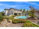 Inviting backyard oasis featuring a sparkling pool and spacious patio at 7 Summit Walk Trl, Henderson, NV 89052