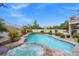 Inviting backyard oasis featuring a sparkling pool and spa at 7 Summit Walk Trl, Henderson, NV 89052