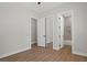 Bedroom with mirrored closet doors and wood floors at 7 Summit Walk Trl, Henderson, NV 89052