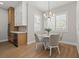 Kitchen breakfast nook with round table and four beige chairs at 7 Summit Walk Trl, Henderson, NV 89052