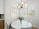 Bright breakfast nook with round table and modern chandelier at 7 Summit Walk Trl, Henderson, NV 89052