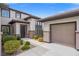 Elegant home exterior with a welcoming entryway and attached garage at 7 Summit Walk Trl, Henderson, NV 89052