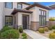 House exterior featuring a stylish entryway and two-car garage at 7 Summit Walk Trl, Henderson, NV 89052