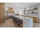 Spacious kitchen with marble countertops, stainless steel appliances, and two-toned cabinetry at 7 Summit Walk Trl, Henderson, NV 89052