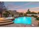 Inviting pool and spa with a tranquil atmosphere in the backyard at 7 Summit Walk Trl, Henderson, NV 89052