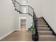 Modern staircase with black metal railings and carpet at 7 Summit Walk Trl, Henderson, NV 89052