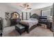 Elegant bedroom with a plush bed and dark wood furniture at 7141 Liberty Landing St, Las Vegas, NV 89166