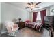 Bedroom with bed, dresser and ceiling fan at 7141 Liberty Landing St, Las Vegas, NV 89166