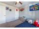 bedroom with a bed, dresser, and playful wall art at 7141 Liberty Landing St, Las Vegas, NV 89166