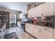 Bright kitchen with white cabinets and granite counters at 7141 Liberty Landing St, Las Vegas, NV 89166