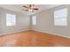 Spacious bedroom with wood flooring and ceiling fan at 7322 Fools Gold St # 101, Las Vegas, NV 89149