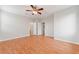 Large bedroom with wood flooring and ceiling fan at 7322 Fools Gold St # 101, Las Vegas, NV 89149