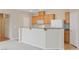 Kitchen boasts light wood cabinets and a breakfast bar at 7322 Fools Gold St # 101, Las Vegas, NV 89149