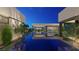 Luxury pool area with reflecting water and modern landscaping at 7349 Olive Creek Ct, Las Vegas, NV 89117