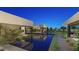 Reflecting pool in a modern landscape design, with lush plants at 7349 Olive Creek Ct, Las Vegas, NV 89117