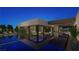 Luxury pool with integrated spa and lounge chairs at 7349 Olive Creek Ct, Las Vegas, NV 89117