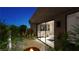 Tranquil zen garden with fire pit and pathway leading to the bathroom at 7349 Olive Creek Ct, Las Vegas, NV 89117