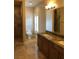 Bathroom with double vanity, granite countertops, and a walk-in shower at 768 Tozzetti Ln, Henderson, NV 89012