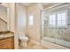 Elegant bathroom with granite vanity, tiled shower, and toilet at 768 Tozzetti Ln, Henderson, NV 89012