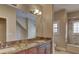 Elegant bathroom with granite double vanity and shower at 768 Tozzetti Ln, Henderson, NV 89012